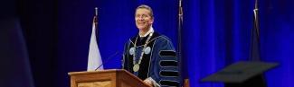 U N E President James Herbert speaking at Commencement